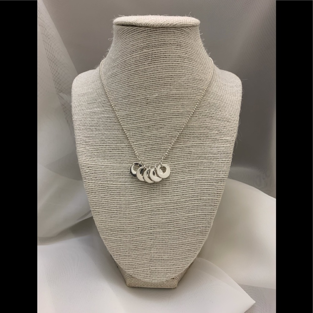 Silver necklace with multi layered rings.
